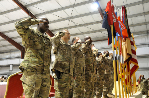 The official party for the Task Force Taskmaster NCO Induction Ceremony, 426th Brigade Support Battalion, 1st Brigade Combat Team, 101st Airborne Division, renders a salute to the colors during the playing of the National Anthem at Jalalabad Airfield, Afghanistan, Feb. 6, 2013. (Sgt. 1st Class John D. Brown/U.S. Army)