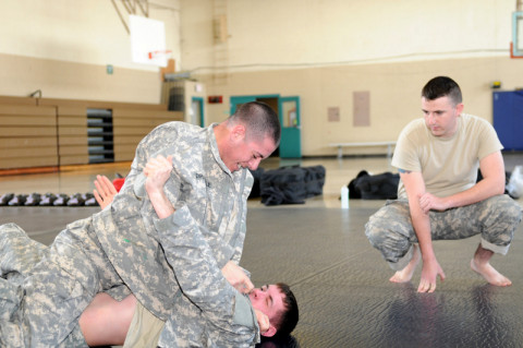 Spc. Billy Robertson, a military police with the 561st Military Police Company, 101st Sustainment Brigade, 101st Airborne Division (Air Assault), observes Spc. Louis Dipasquale an MP (top) and Spc. Dylan Rutherford a mechanic (bottom), both with the MP Company, while they practice combative moves during combative level II training course, March 15, at the Lozada Physical Fitness Center here at Fort Campbell. (Sgt. Sinthia Rosario/U.S. Army) Spc. Billy Robertson, a military police with the 561st Military Police Company, 101st Sustainment Brigade, 101st Airborne Division (Air Assault), observes Spc. Louis Dipasquale an MP (top) and Spc. Dylan Rutherford a mechanic (bottom), both with the MP Company, while they practice combative moves during combative level II training course, March 15, at the Lozada Physical Fitness Center here at Fort Campbell. (Sgt. Sinthia Rosario/U.S. Army)