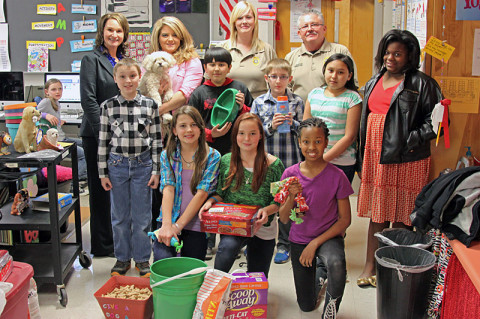 (Far left  standing) Stacy Rogers, KES Attendance Secretary; Christie Prescott, Beta Club Sponsor, with Madison the dog; Rachel Torres, Animal Control; Tim Clifton, Animal Control director. (Next row far left) Dylan Varney, Jumaire Ferrer, Sean Bouma, Yamilet Chavez-Tavera, DeShayla McDuffie. (Front row left) Jade Irwin, Katrina Shackelford, Sydney Boykin.