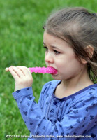 A young girl enjoys a tasty treat at the Rivers and Spires Festival