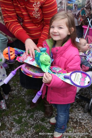 A happy child with her prizes from the hunt.