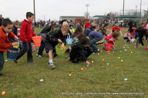 Kids scoop up Easter Eggs during the  City of Clarksville's 2013 Spring Eggstravanganza Easter Egg Hunt