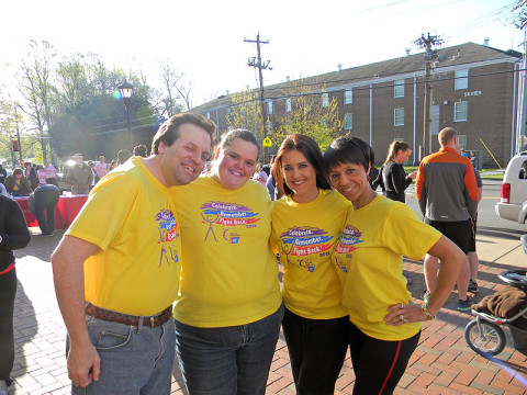 Relay For Life Leadership Team take a break before the start of the Breast Cancer 5k--Paul Farley, Brittnye Davis Farley, Online Chair, Cydney Miller, Event Co-Chair and Kathleen Evans, Promotions Chair. (Photo by Henderson Hill)