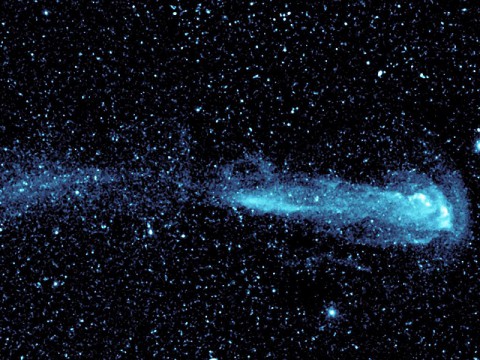 A speeding star can be seen leaving an enormous trail in this image from NASA?s Galaxy Evolution Explorer. (Image credit: NASA/JPL-Caltech)