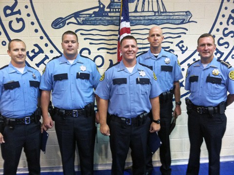 The graduates from left, Deputies Eric Trout, Patrick Turner, Christopher Owens, and Robert Parker. Montogmery County Sheriff John Fuson is on the right.