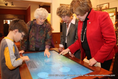 Montgomery County Mayor Carolyn Bowers, Clarksville Mayor Kim McMillan, and Montgomery County Historian Eleanor Williams look at one of the exhibits
