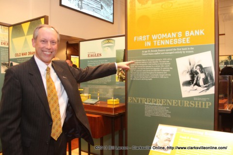 Steve Kemmer the President of US Bank takes special interest in a banking exhibit