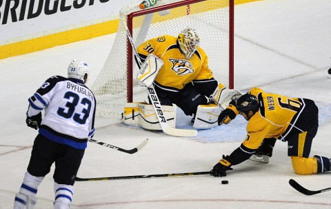 Nashville Predators goalie Carter Hutton (30) and Predators defenseman Shea Weber (6) defend against the shot of Winnipeg Jets defenseman Dustin Byfuglien (33) at Bridgestone Arena. (Mike Strasinger-USA TODAY Sports) Nashville Predators goalie Carter Hutton (30) and Predators defenseman Shea Weber (6) defend against the shot of Winnipeg Jets defenseman Dustin Byfuglien (33) at Bridgestone Arena. (Mike Strasinger-USA TODAY Sports)