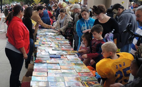 Families look through free books as part of APSU’s Phi Kappa Phi chapter’s annual Candy for the Mind Project.