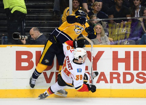 Nashville Predators left wing Nick Spaling (13) collides with Calgary Flames center Ben Street (38) during the second period at Bridgestone Arena.(Don McPeak-USA TODAY Sports)