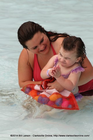 A mother helps her Toddler at the City of Clarksville's Wettest Egg Hunt on Saturday