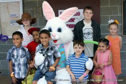 A family poses for a photo with the Easter Bunny at the City of Clarksville's 2014 Spring Eggstravaganza