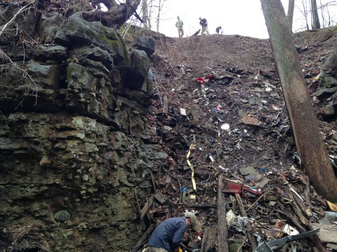 A soldier from the 744th Ordnance Company lends a hand cleaning up the "Rather property"