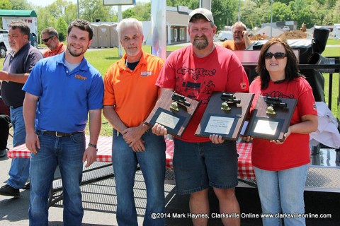 Grillin' & Chillin' out of Paris, TN won Grand Champion of the 2014 Hilltop Super Market 5th annual BBQ Cook-Off.  (L to R) Cody Jackson; owner Hilltop, Mike Jackson; owner Hilltop, James Brawner and Lisa Brawner.