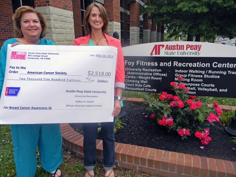 Jerri Rule (left) with the American Cancer Society received a $2,518.00 donation from Lauren-Michael Wilkinson (right).