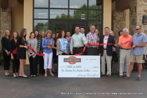 Clarksville Mayor Kim McMillan cuts the ribbon for the Liberty Park Grill