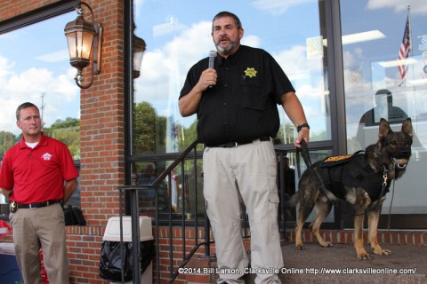 Montgomery County Sheriff John Fuson looks on as MCSO SGT. Mike Oliver with his K-9 partner Links speak to the crowd