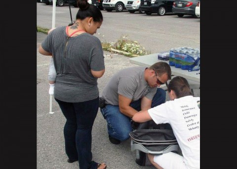 Deputy Jason Pike helps check a child seat. The Montgomery County Sheriff’s Office will be conducting free child car seat safety checks from 10:00am to 2:00pm Saturday at Kohl’s, 2840 Wilma Rudolph Boulevard.