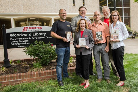 Patrick Toth, former PAT president; Deanna Carter, APSU history instructor; Joe Weber, APSU library director; Brian Heaton, APSU library associate; John Steinberg, APSU history chair; and Minoa Uffelman, APSU associate professor of history, show off the books the PAT club has donated to the library over the years. (Taylor Slifko/APSU)