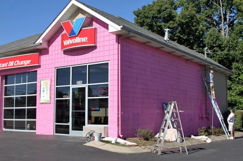 Valvoline Complete Car Care on Wilma Rudolph Boulevard paints it's building "pink" for Breast Cancer awareness Month.