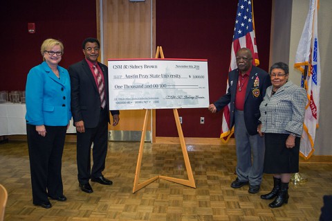 APSU President Alisa White, APSU Military Alumni Chapter President Joe Shakeenab, retired Command Sgt. Maj. Sidney Brown and his wife, Jimilla Brown. (Beth Liggett/APSU).