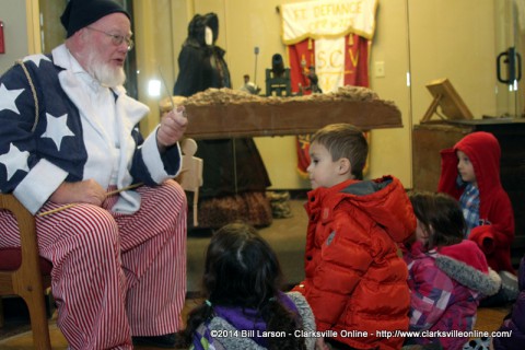 Santa Claus tell stories to children at Christmas in Occupied Clarksville at the Fort Defiance Interpretive Center