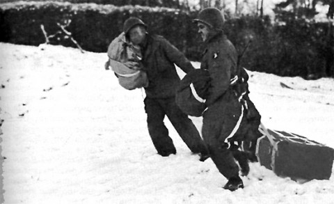 101st Airborne Division personnel retrieve an A-4 Aerial Delivery Container containing medical supplies. Photo taken in the Bastogne area. Resupply missions took place between 23-27 December 1944.