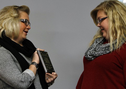 Campus Director, Kala Fielder, presents Gina Castleberry with personal plaque at the ceremony naming the campus learning resource Center, the “Gina Castleberry Learning Resource Center.” (Lois Jones)