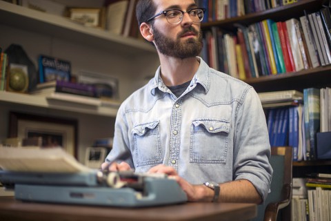 English student Conor Scruton composes a poem on a typewriter in APSU's Harned Hall on Monday, April 13, 2015. (Beth Liggett, APSU)