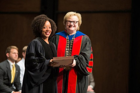 Austin Peay President Alisa White presents Dr. Dwonna Goldstone, professor of languages and literature, with the Richard M. Hawkins Award. (Adison Hardyway/APSU)