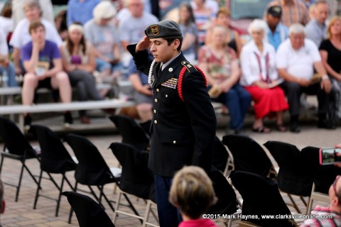 A Montgomery Central JROTC Cadet salutes a chair recognizing a missing soldier
