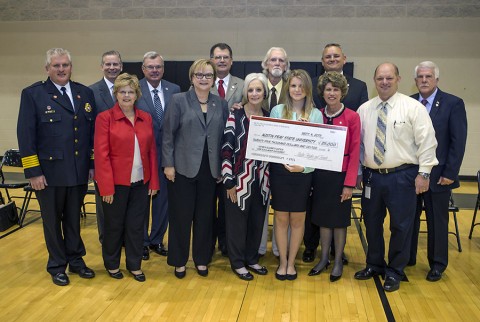 The Kathryn Watson Over Endowment, created by Skylar Hughes, 18, to honor the memory of her former teacher Kathryn Watson Over who died along with four other people on Sept. 18, 2011 from carbon monoxide poisoning, is announced during a ceremony at Kenwood High School on Tuesday, Sept. 15, 2015. (Beth Liggett, APSU)