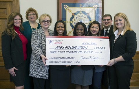 Chapter officers present APSU President Dr. Alisa White with a check.