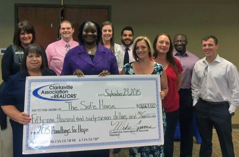 Young Professionals Network presents a check for $51,067 to Urban Ministries’ The SafeHouse.