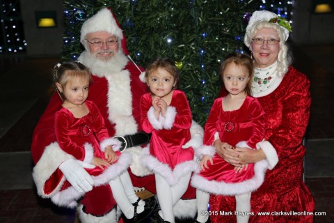 Three well dressed ladies visiting with Santa Claus and Mrs. Claus at Christmas on the Cumberland.