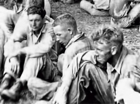 (L to R) Preston J. Hubbard, age at the time: 23, Paul G. Inzer, age at the time: 16, and a soldier not identified. This picture is of a rest stop, on the Death March, in Balanga, Bataan. (L to R) Preston J. Hubbard, age at the time: 23, Paul G. Inzer, age at the time: 16, and a soldier not identified. This picture is of a rest stop, on the Death March, in Balanga, Bataan.