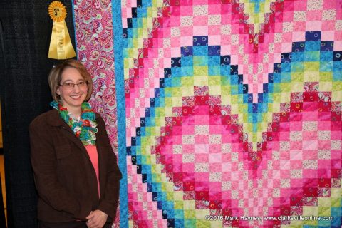 Dana Fucella with her quilt "Heart Bargello" that won third place in the Non-Traditional Bed Quilt category at Quilts of the Cumberland.