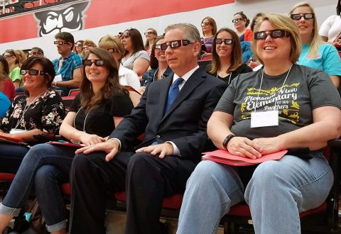 Tennessee State Representative Joe Pitts tries out a pair of solar glasses during a recent educational summit at APSU. 