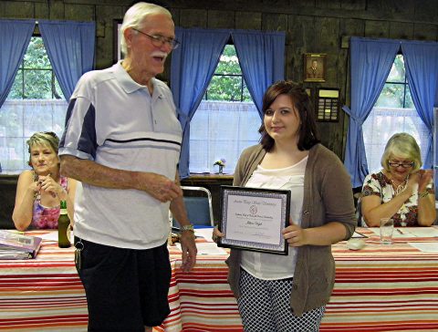 Jillian Vogel, a German minor at Austin Peay State University, receives a scholarship from Bob Perkins, president of the Clarksville Edelweiss Club.