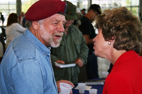 Clarksville Mayor Kim McMillan greets military veterans in town for a Welcome Home Parade on Thursday. 