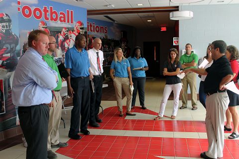 APSU Athletic Director Ryan Ivey addresses some members of the TSSAA delegation in the Fortera Stadium locker room. Pictured left to right are: TSSAA Assistant Executive Director Mark Reeves, Executive Director Bernard Childress, TSSAA Technology Director Bradley Lambert, APSU Athletic Director Ryan Ivey, and TSSAA Assistant Executive Director Richard McWhirter.