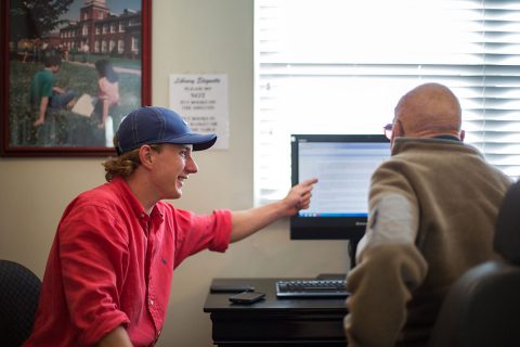 APSU Computer Science student Blake Crozier teaches Computer Literacy to a Senior Citizen.