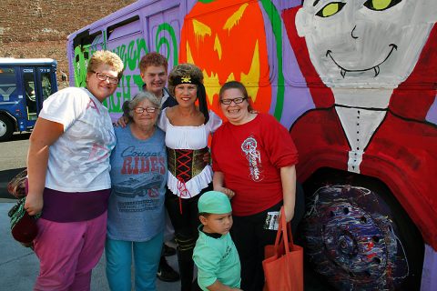 Clarksville Mayor Kim McMillan gets ready to board the Spooky Special with a group of Clarksville Transit System passengers Saturday at the Transit Center.