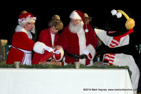 Mrs. Claus, Clarksville Mayor Kim McMillan, Santa Claus and Snow Bird flip the switch officially turning on the lights for Christmas on the Cumberland.