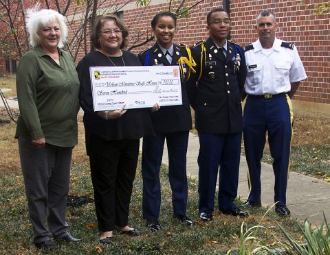 (From left to Right) Montgomery County Sheriff Deputy Peggy Macias, SafeHouse representative Diane Herndon, JROTC Cadet Lt. Col. Kelsey Thornton (Battalion Commander), JROTC Cadet Major Aaron Rice (Executive Officer) and JROTC instructor Edward Coleman (CW3 Retired).