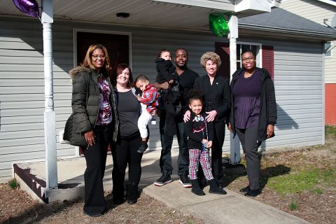 Clarksville Mayor Kim McMillan greets the Lee family, Chasity, Vincent, Za’Den, Kay’Lisa and La’Miyah as they prepare to move into a new home provided by Flourishing Families, a Clarksville social service agency. 