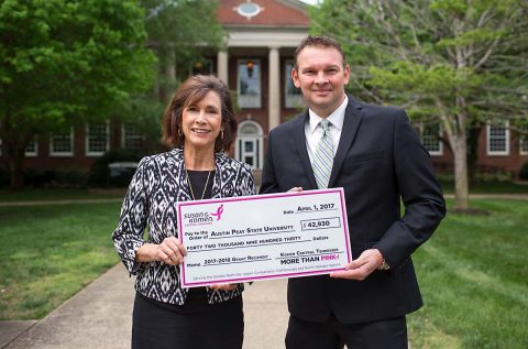 Dr. Nancy Orr with the Susan G. Komen Foundation presents a check to Montgomery County Health Department Director Joey Smith for beast health. (APSU)