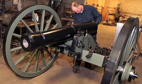 Clarksville Foundry patternmaker James Lumpkin puts the finishing touches on the replica Model 1841 6-Pounder Field Gun produced entirely at Clarksville Foundry. Clarksville Foundry cast the entire Civil War-era replica cannon, including the barrel and carriage. Clarksville Rotary Club commissioned the cannon in honor of its 100th Anniversary this month. (Greg Williamson)
