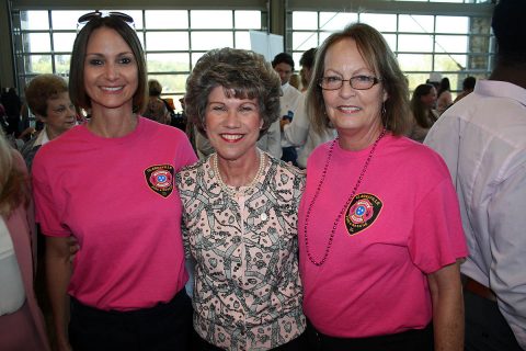 Clarksville Mayor Kim McMillan congratulates Gina Mills (left) and Susan Harris for their work selling pink Clarksville Fire Rescue T-shirts, raising a $2,500 donation to the YMCA's ABC Program. Clarksville Mayor Kim McMillan congratulates Gina Mills (left) and Susan Harris for their work selling pink Clarksville Fire Rescue T-shirts, raising a $2,500 donation to the YMCA's ABC Program.