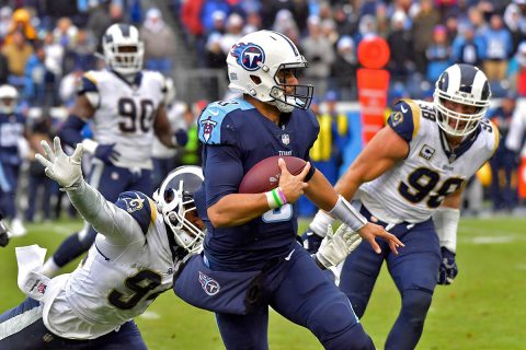 Tennessee Titans quarterback Marcus Mariota (8) rushes against Los Angeles Rams outside linebacker Robert Quinn (94) during the second half at Nissan Stadium. (Jim Brown-USA TODAY Sports) Tennessee Titans quarterback Marcus Mariota (8) rushes against Los Angeles Rams outside linebacker Robert Quinn (94) during the second half at Nissan Stadium. (Jim Brown-USA TODAY Sports)